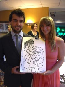 Happy couple caricature drawn by walkabout caricaturist